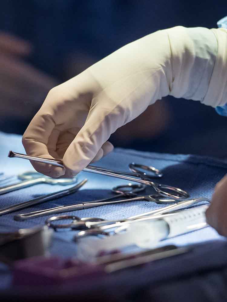 surgical tech hand with tools